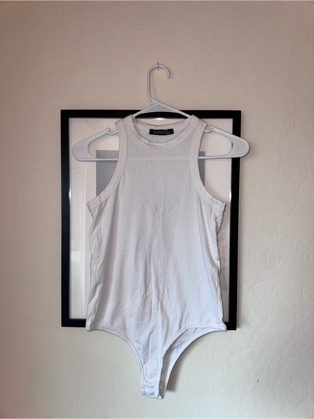 3 White bodysuits